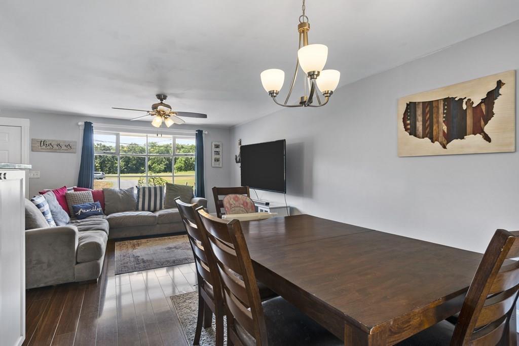 266 Bushee Road Swansea, MA 02777 - Photo 10 of 33 a view of a dining room with furniture a chandelier and wooden floor