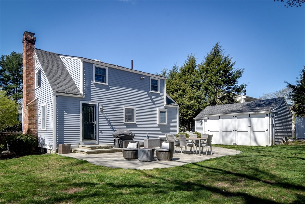 52 Wesley Road Framingham, MA 01701 - Photo 26 of 29 a view of a house with backyard and sitting area