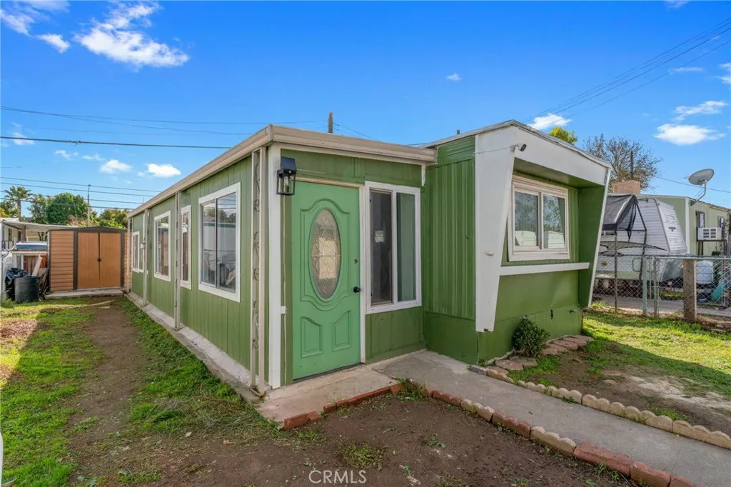a view of a house with a small yard