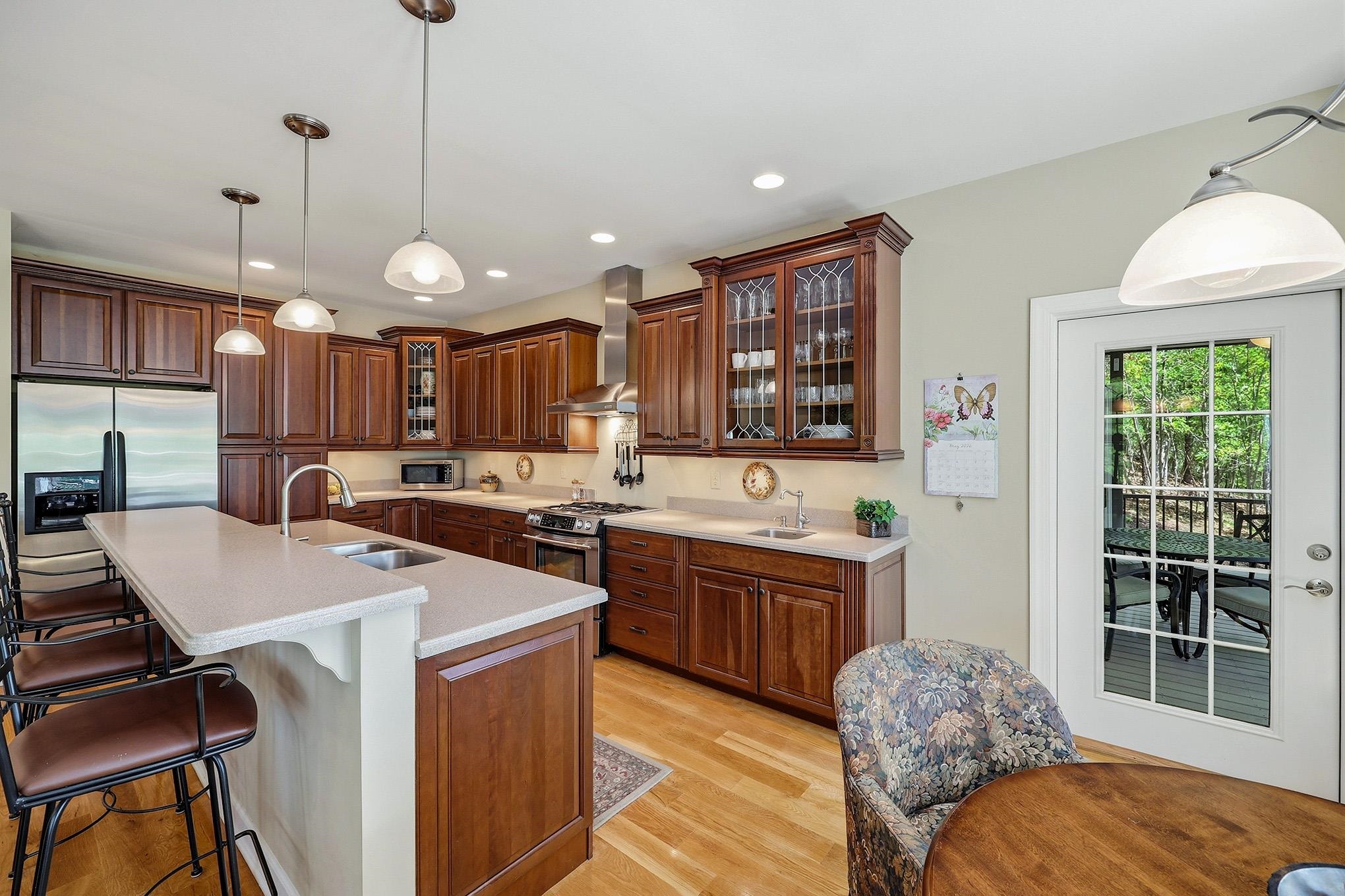 759 Rife's Ford Road Verona, VA 24482 - Photo 12 of 66 a large kitchen with kitchen island a stove a sink a dining table and chairs