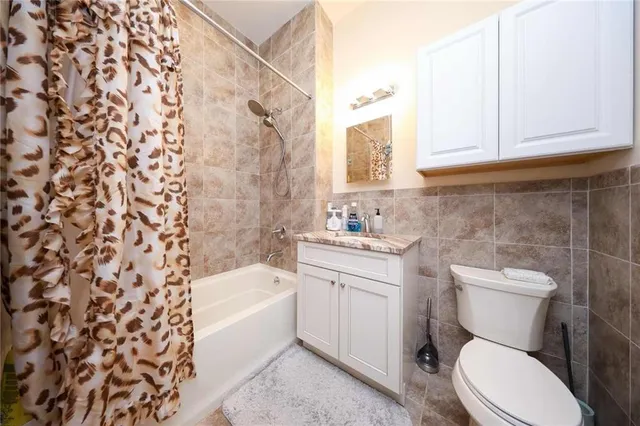 a bathroom with a sink a toilet and bathtub