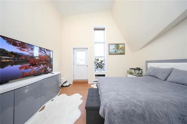 a bedroom with a bed and a sink