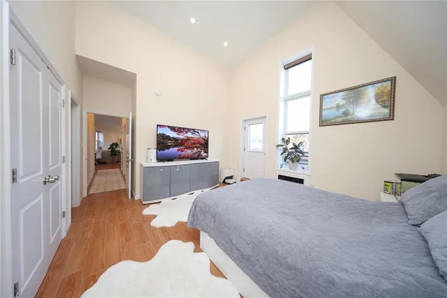 a bedroom with a bed and a couch