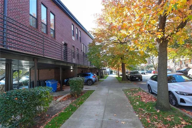 a view of a car park in front of house