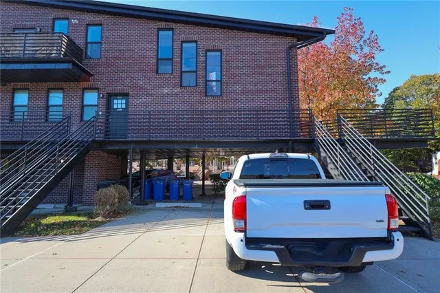 a car park in front of a house