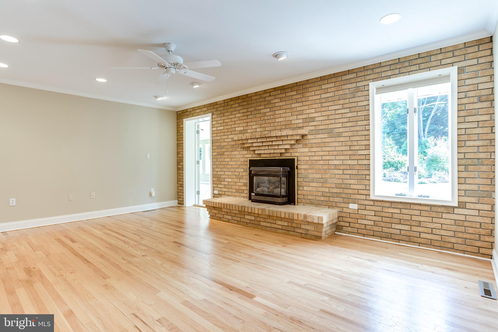 3907 Eland Road Phoenix, MD 21131 - Photo 11 of 33 Family Room w/ Hardwood Floors & Gas Fireplace