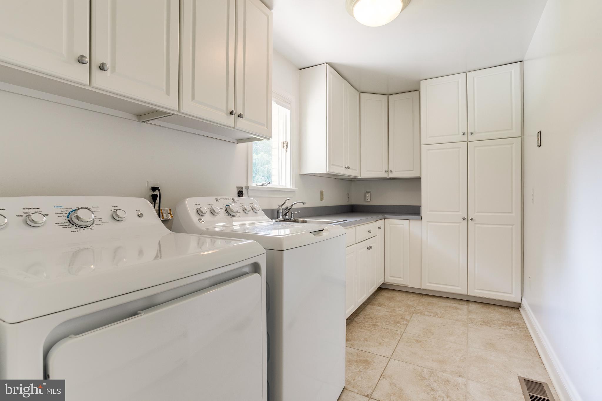 3907 Eland Road Phoenix, MD 21131 - Photo 23 of 33 Laundry Room w/ Ample Cabinets