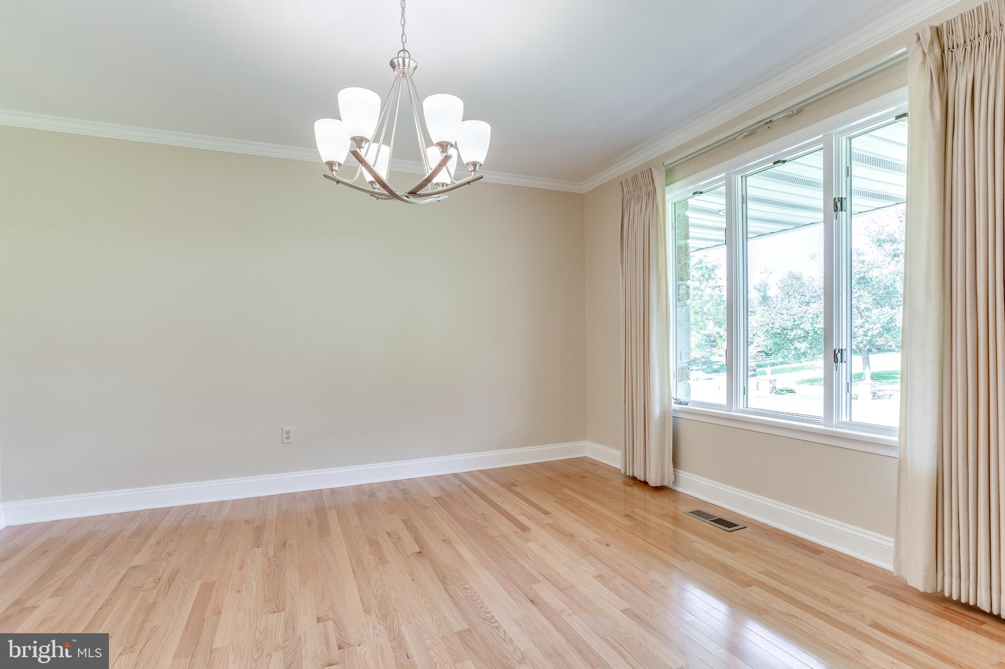 3907 Eland Road Phoenix, MD 21131 - Photo 7 of 33 Dining Room w/ Hardwood Floors & Crown Molding