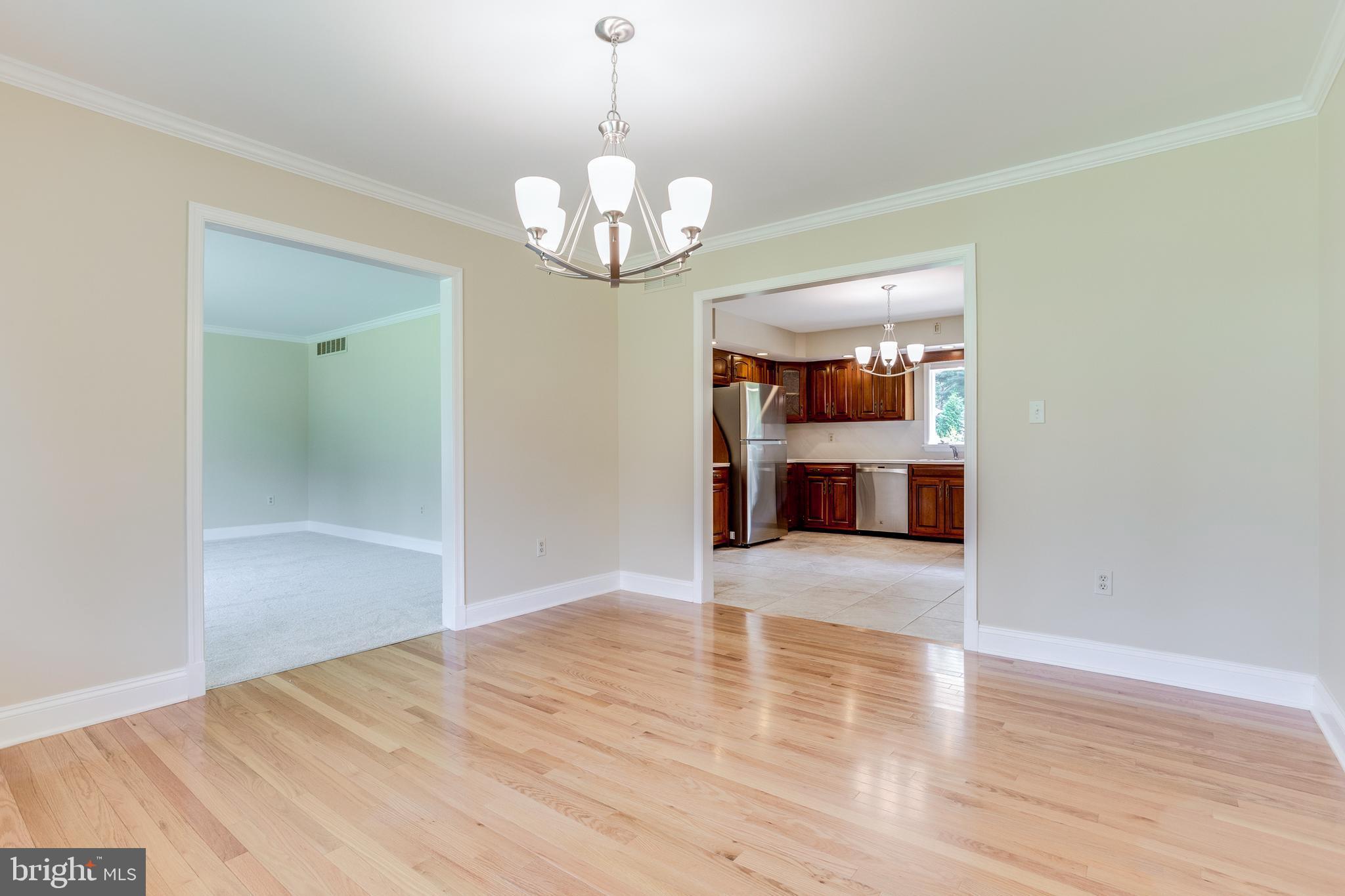 3907 Eland Road Phoenix, MD 21131 - Photo 8 of 33 Dining Room w/ Hardwood Floors & Crown Molding
