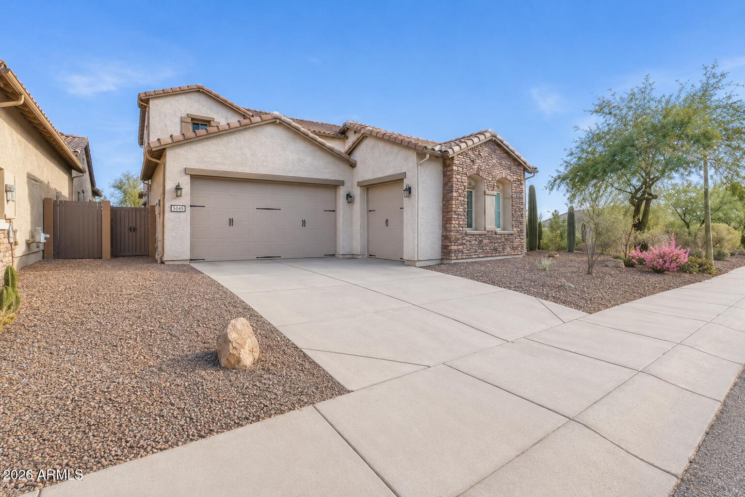 1615 West Red Fox Road Phoenix, AZ 85085 - Photo 4 of 64 a view of a house with a yard and potted plants