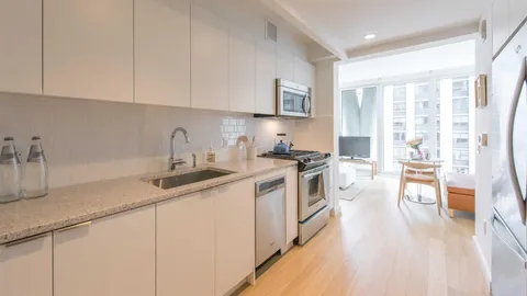 a bedroom with a bed and a cabinets