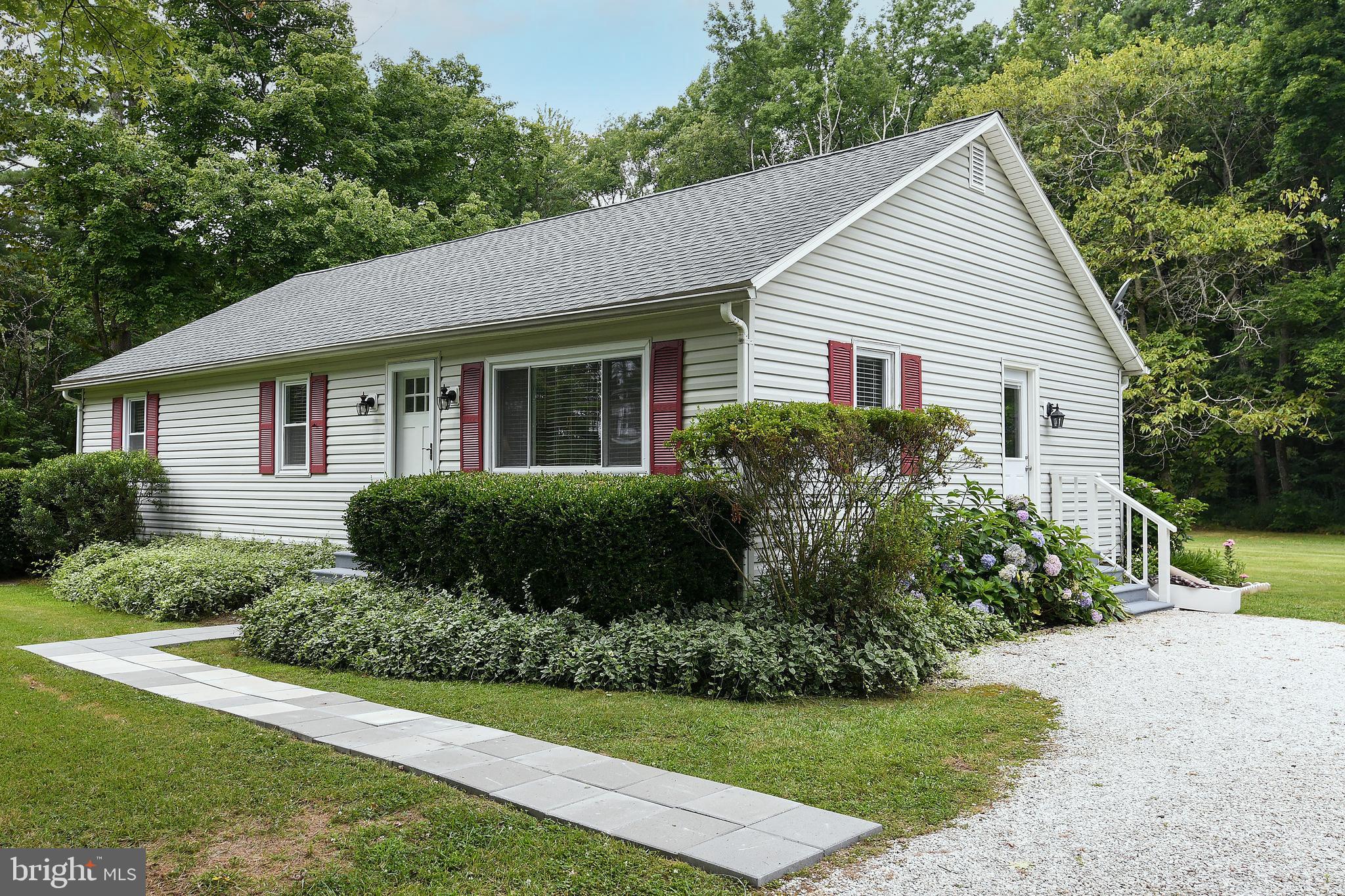 Gravel driveway and side entrance