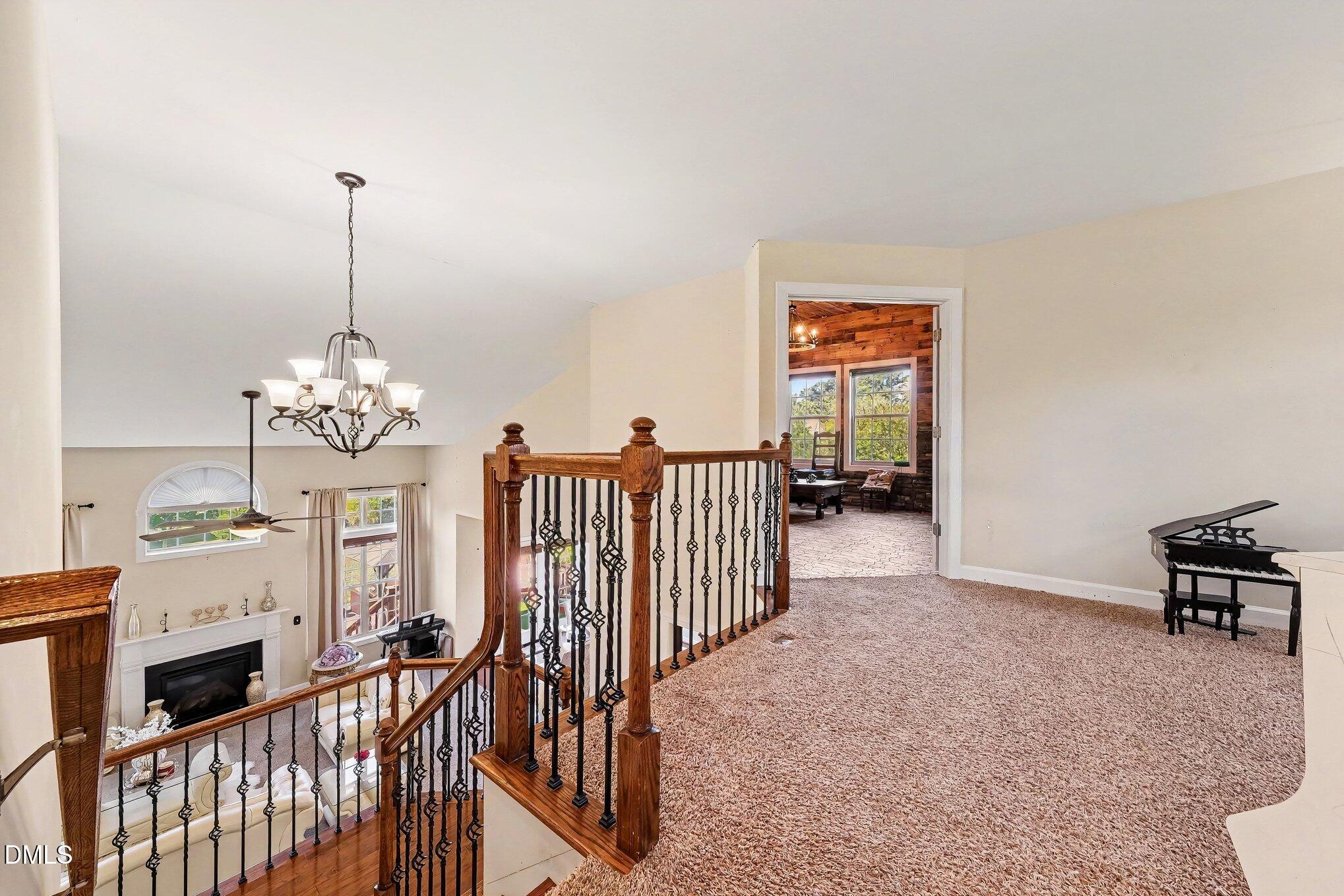 4000 Banks Stone Drive Raleigh, NC 27603 - Photo 33 of 60 a view of a hallway with furniture and chandelier