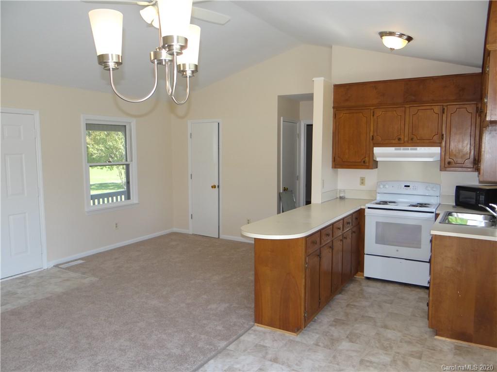 4315 Catawba Burris Road Denver, NC 28037 - Photo 6 of 20 a kitchen that has a lot of cabinets in it