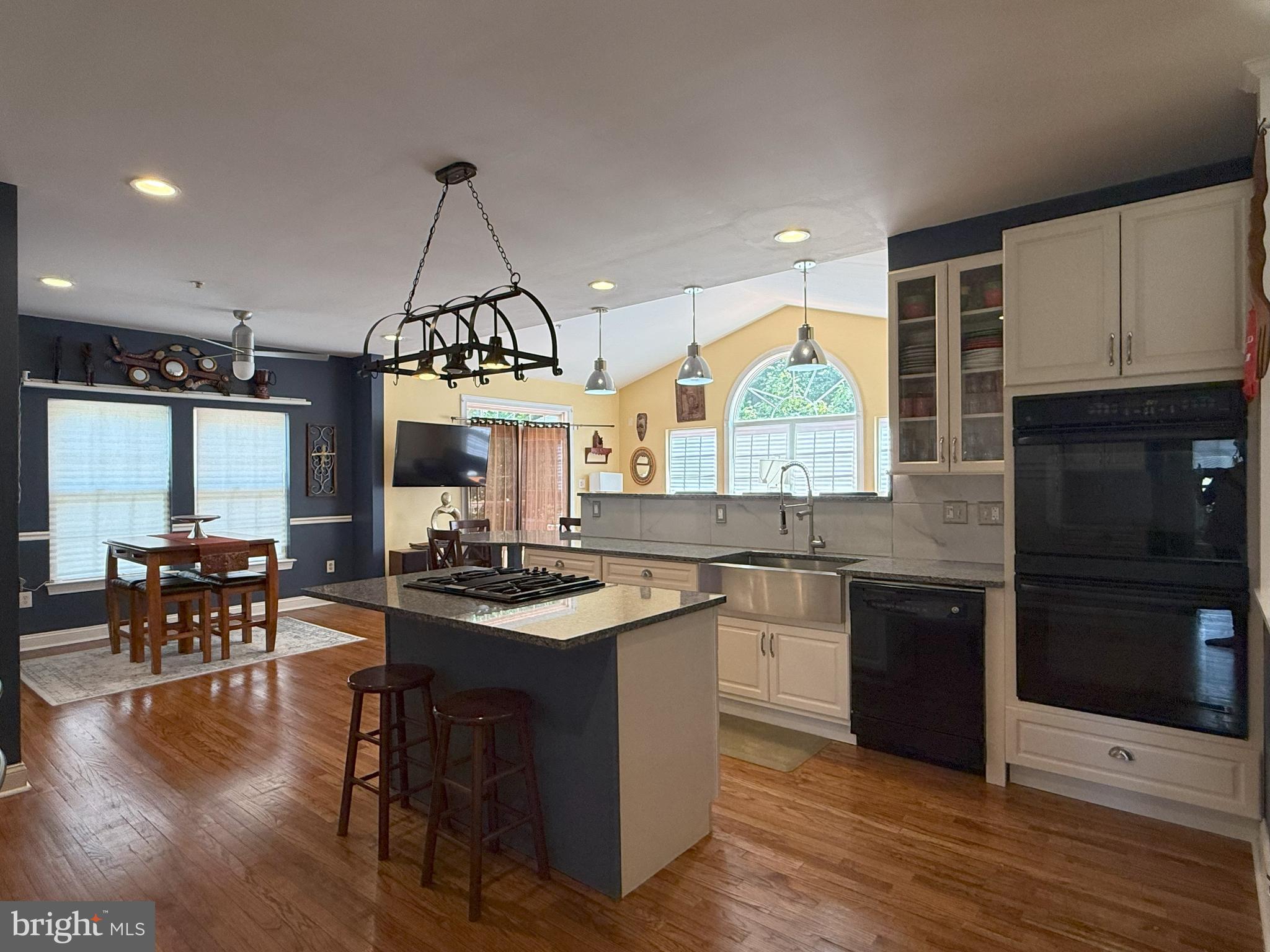 3919 Woodreed Drive Brandywine, MD 20613 - Photo 16 of 88 a kitchen with stainless steel appliances granite countertop a stove and a wooden floors