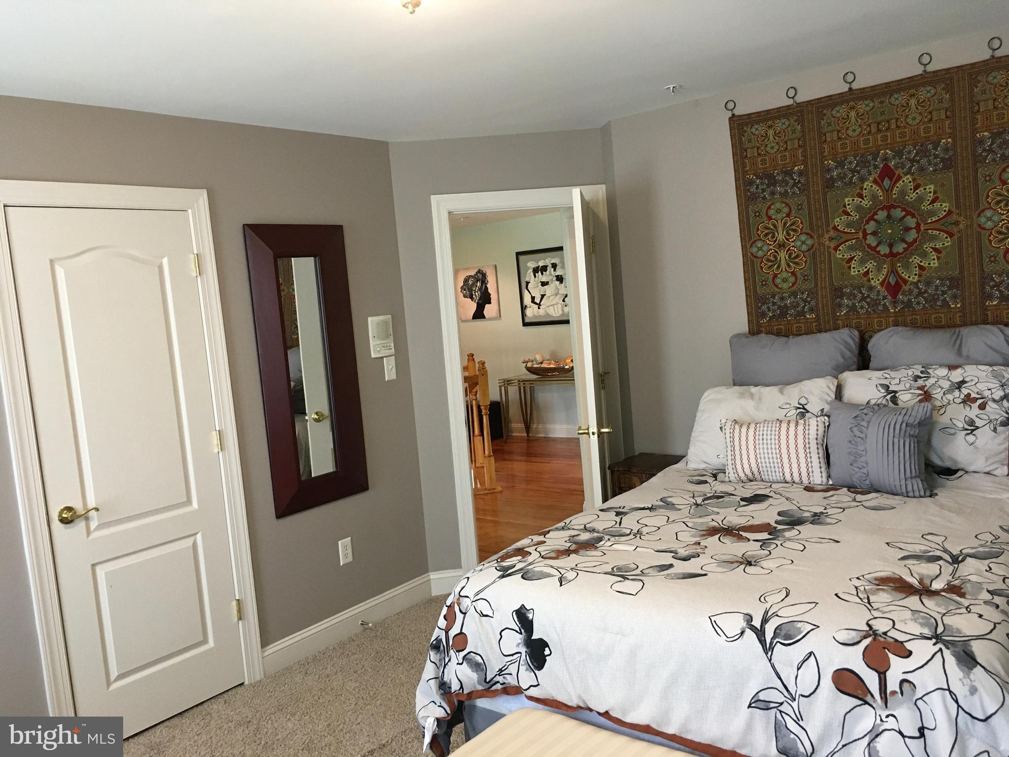 3919 Woodreed Drive Brandywine, MD 20613 - Photo 27 of 88 a bedroom with a bed and a mirror
