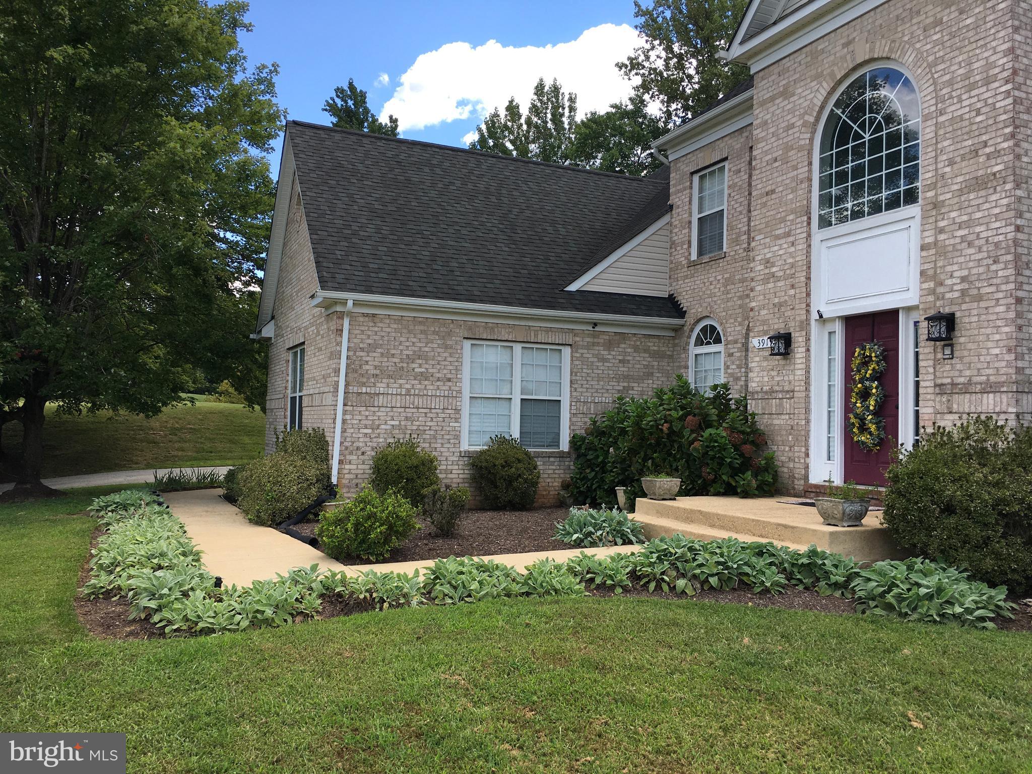 3919 Woodreed Drive Brandywine, MD 20613 - Photo 3 of 88 a front view of a house with a yard