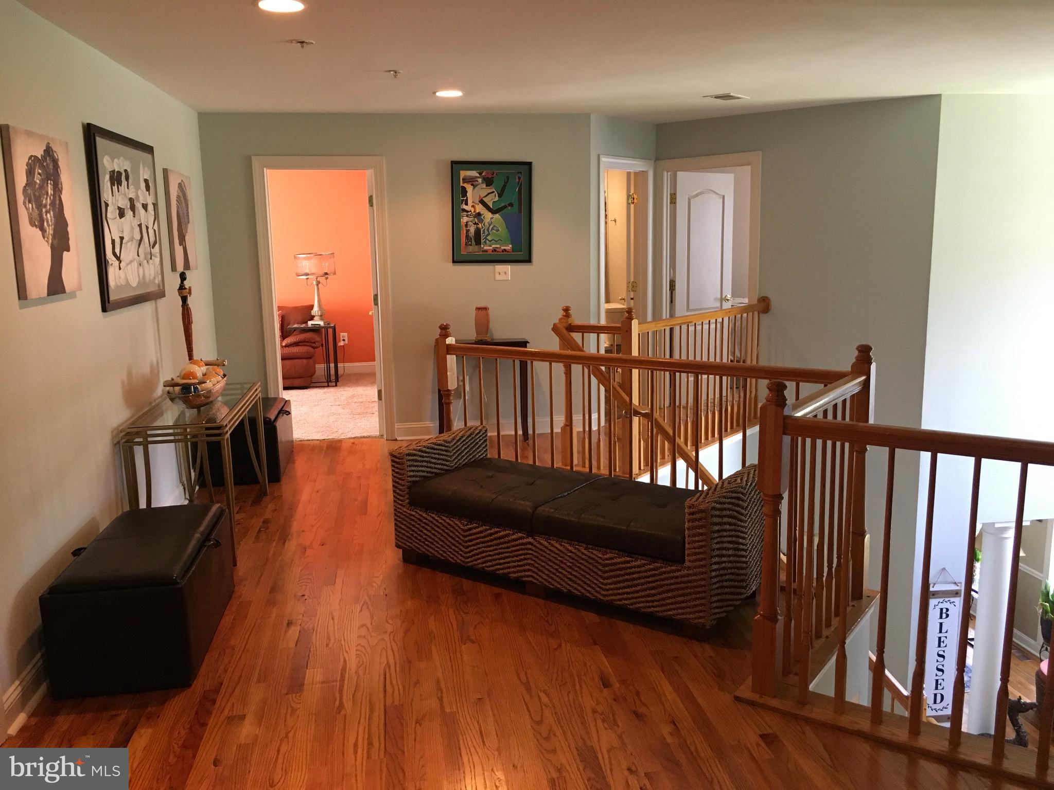 3919 Woodreed Drive Brandywine, MD 20613 - Photo 32 of 88 a living room with furniture and a wooden floor