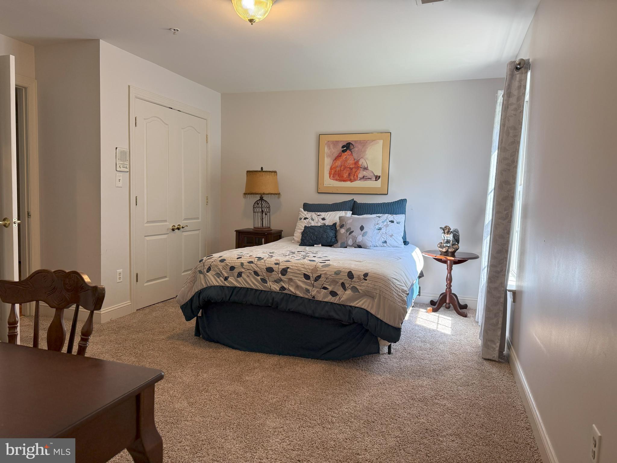 3919 Woodreed Drive Brandywine, MD 20613 - Photo 35 of 88 a bedroom with a bed and a table in it