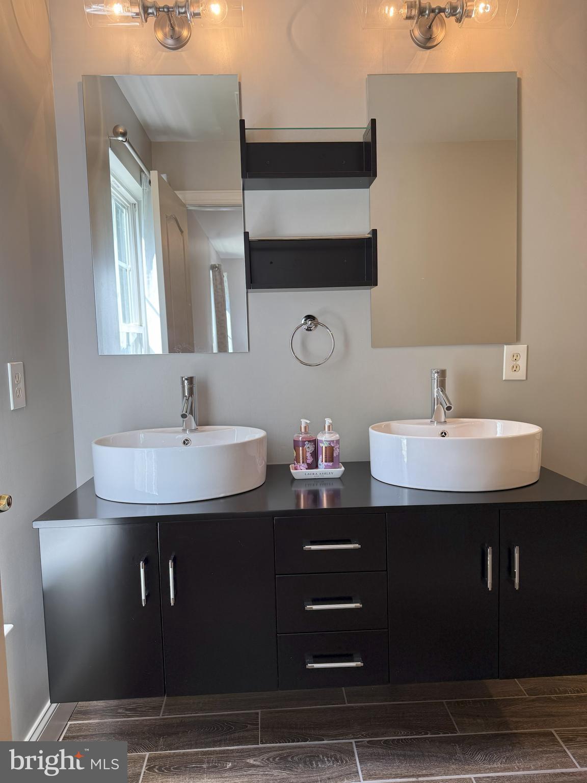 3919 Woodreed Drive Brandywine, MD 20613 - Photo 37 of 88 a bathroom with a sink and a mirror