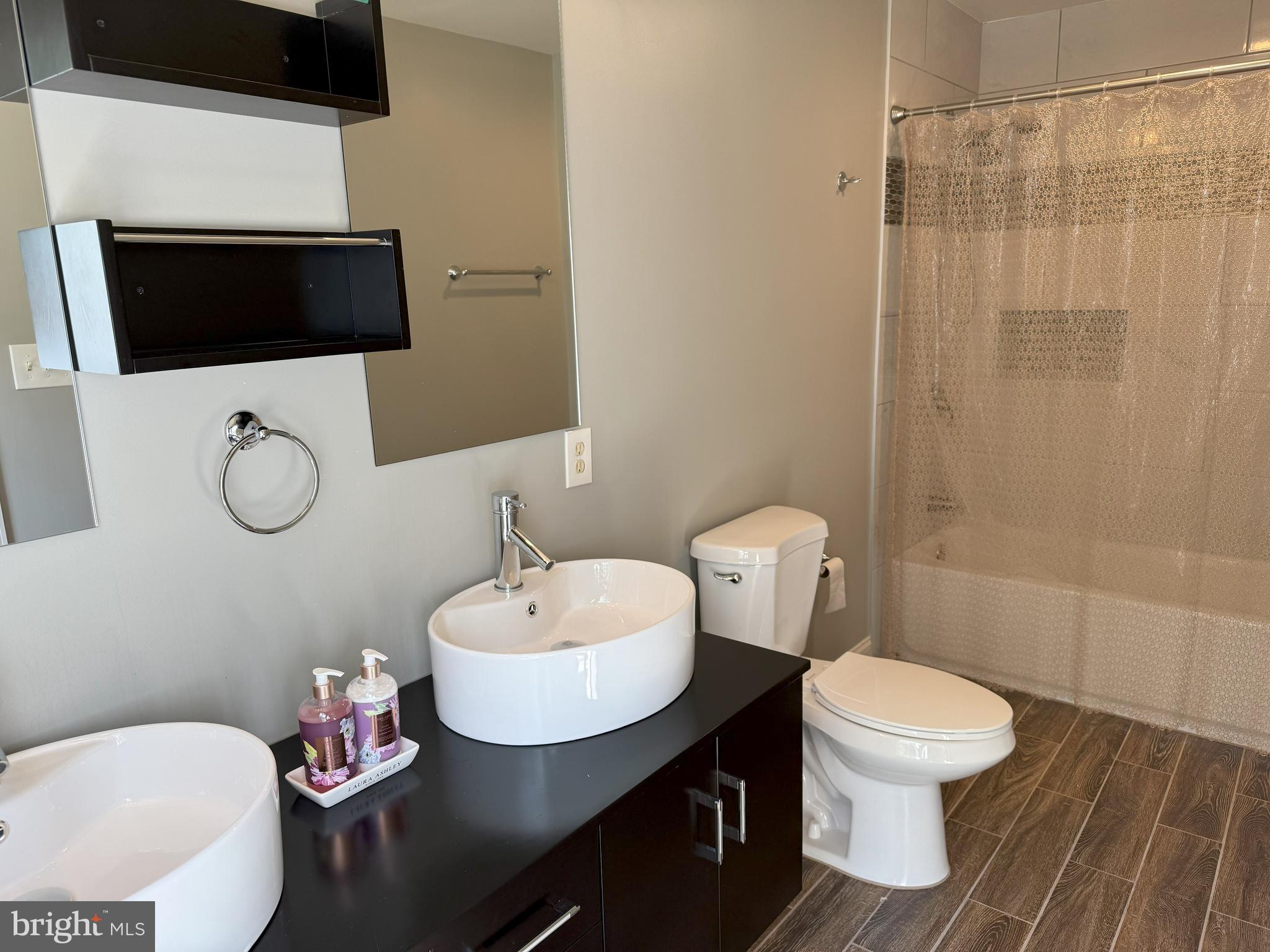 3919 Woodreed Drive Brandywine, MD 20613 - Photo 38 of 88 a bathroom with a sink toilet a mirror and shower