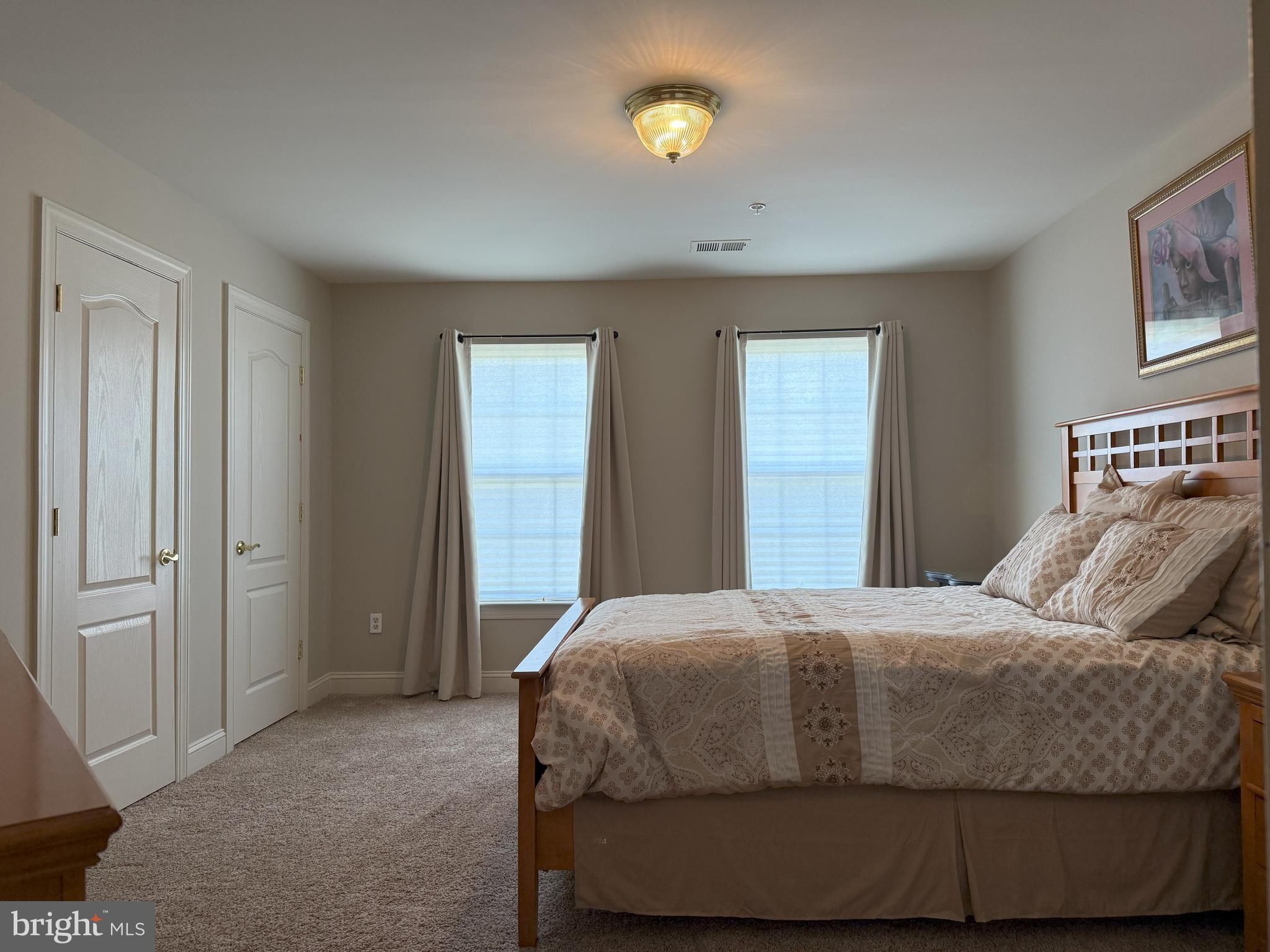 3919 Woodreed Drive Brandywine, MD 20613 - Photo 41 of 88 a bedroom with a bed and painting on the wall