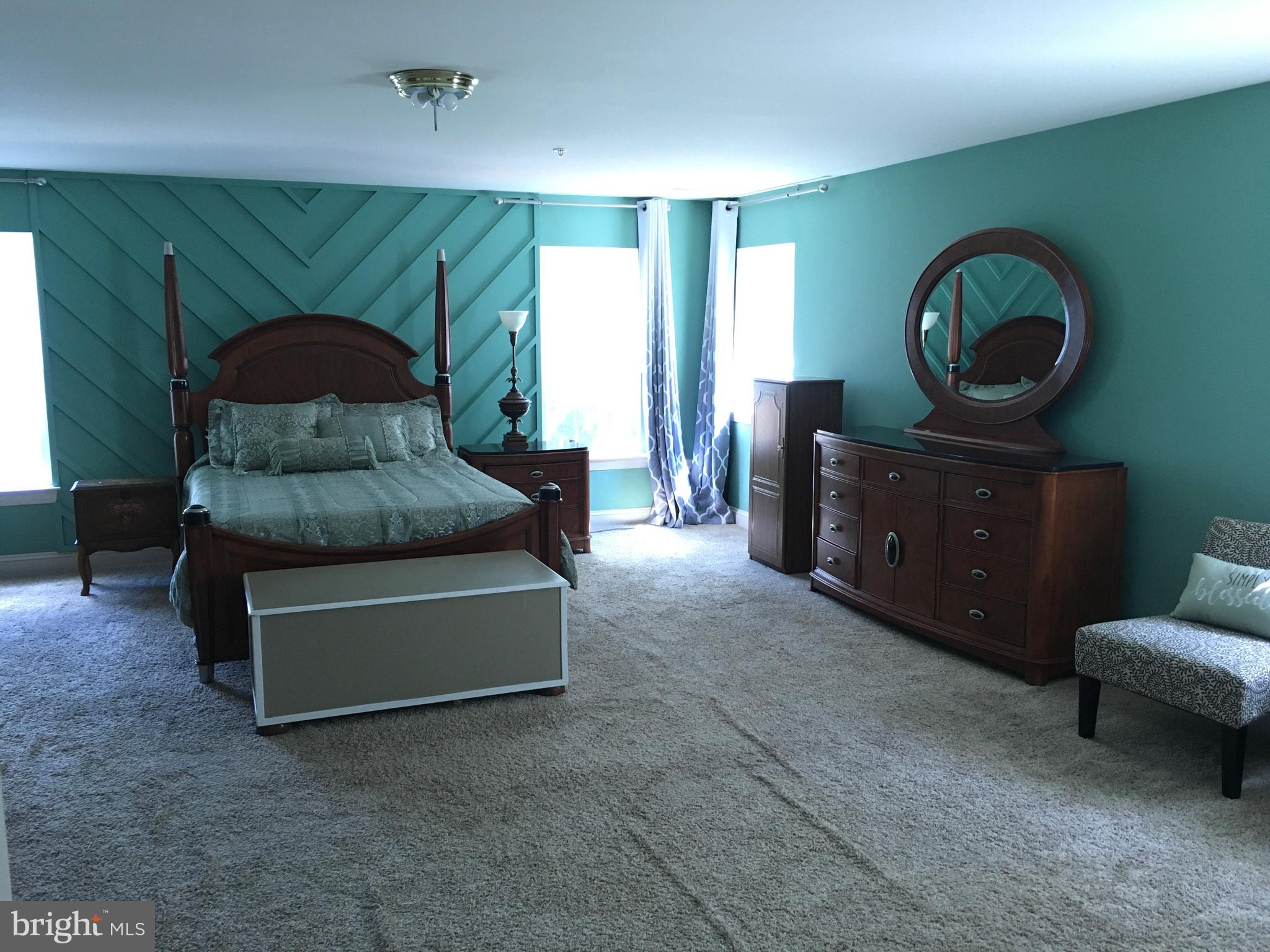 3919 Woodreed Drive Brandywine, MD 20613 - Photo 42 of 88 a living room with furniture and a wooden floor