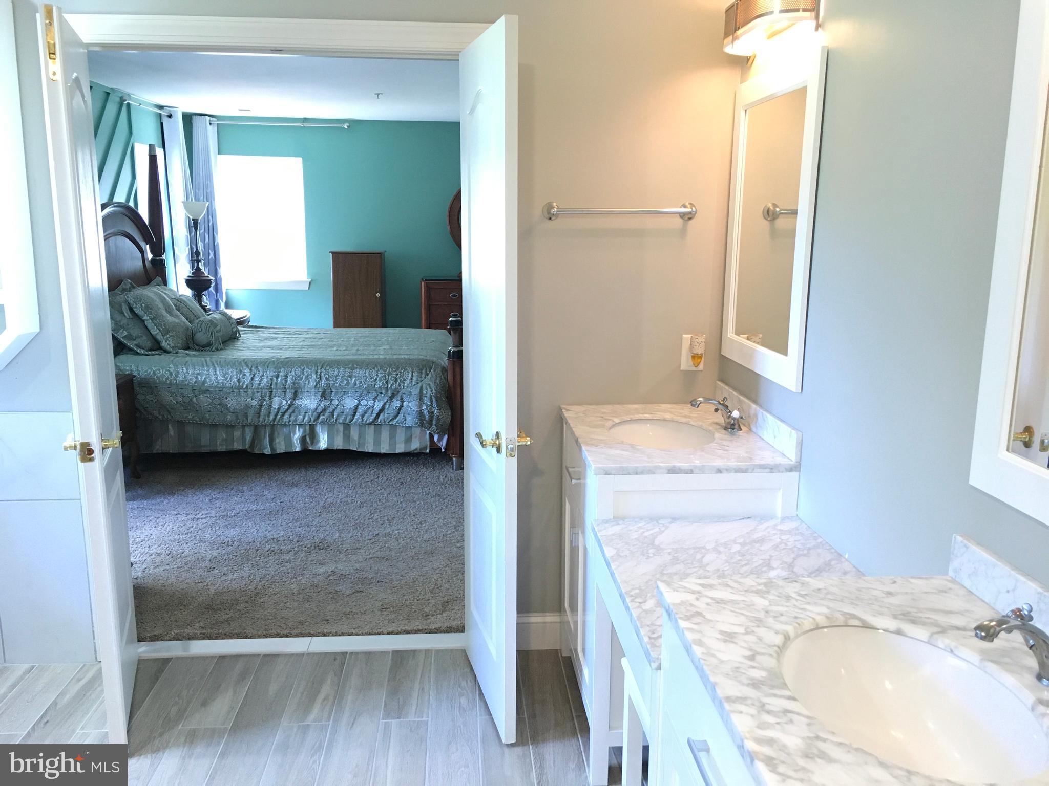 3919 Woodreed Drive Brandywine, MD 20613 - Photo 45 of 88 a en suite bathroom with a granite countertop sink and a mirror