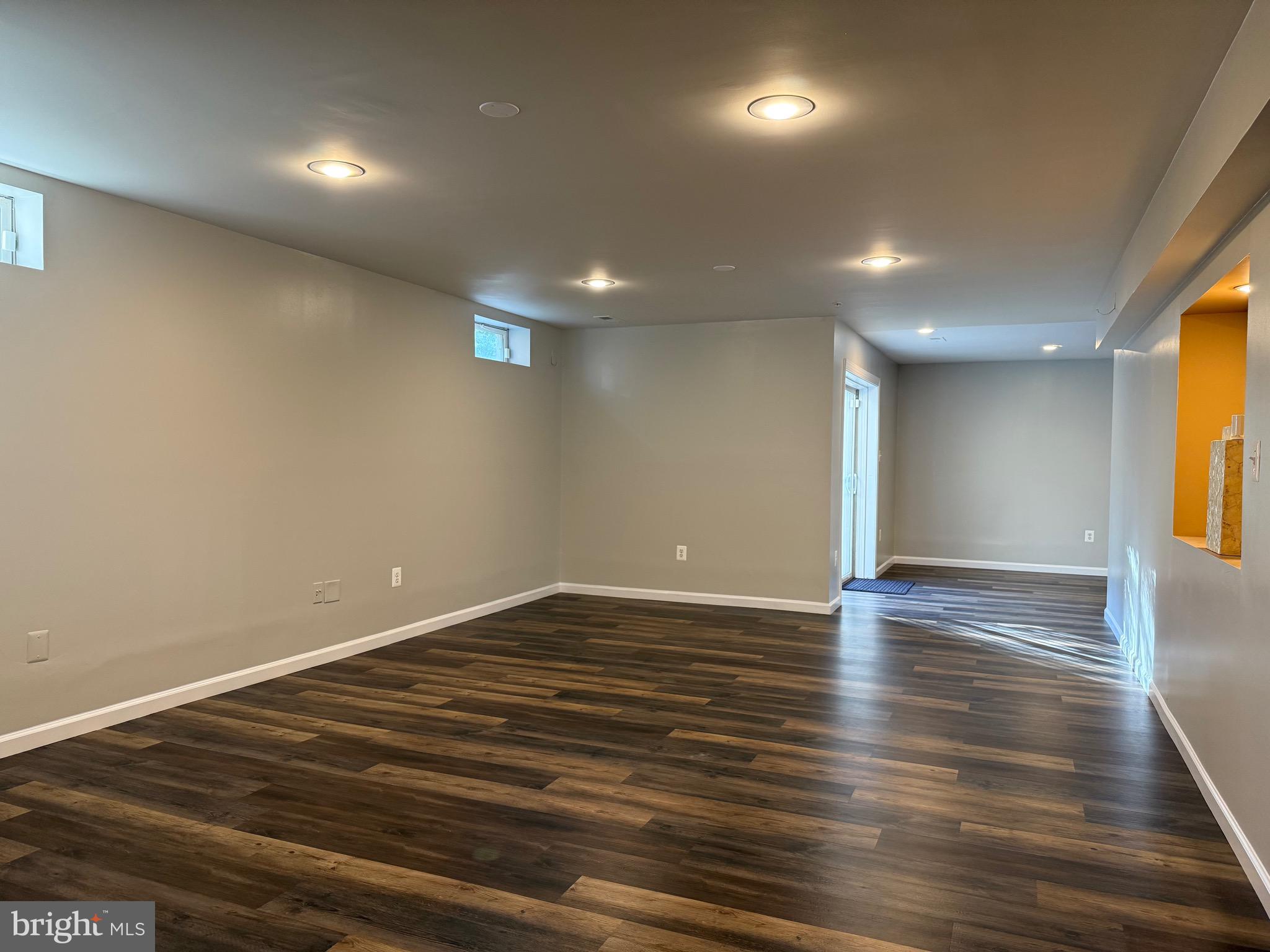 3919 Woodreed Drive Brandywine, MD 20613 - Photo 58 of 88 an empty room with wooden floor and windows