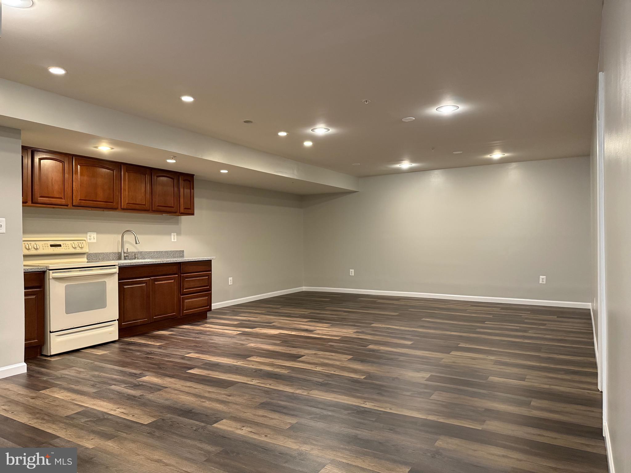 3919 Woodreed Drive Brandywine, MD 20613 - Photo 60 of 88 a view of kitchen with stainless steel appliances wooden floor and stove top oven