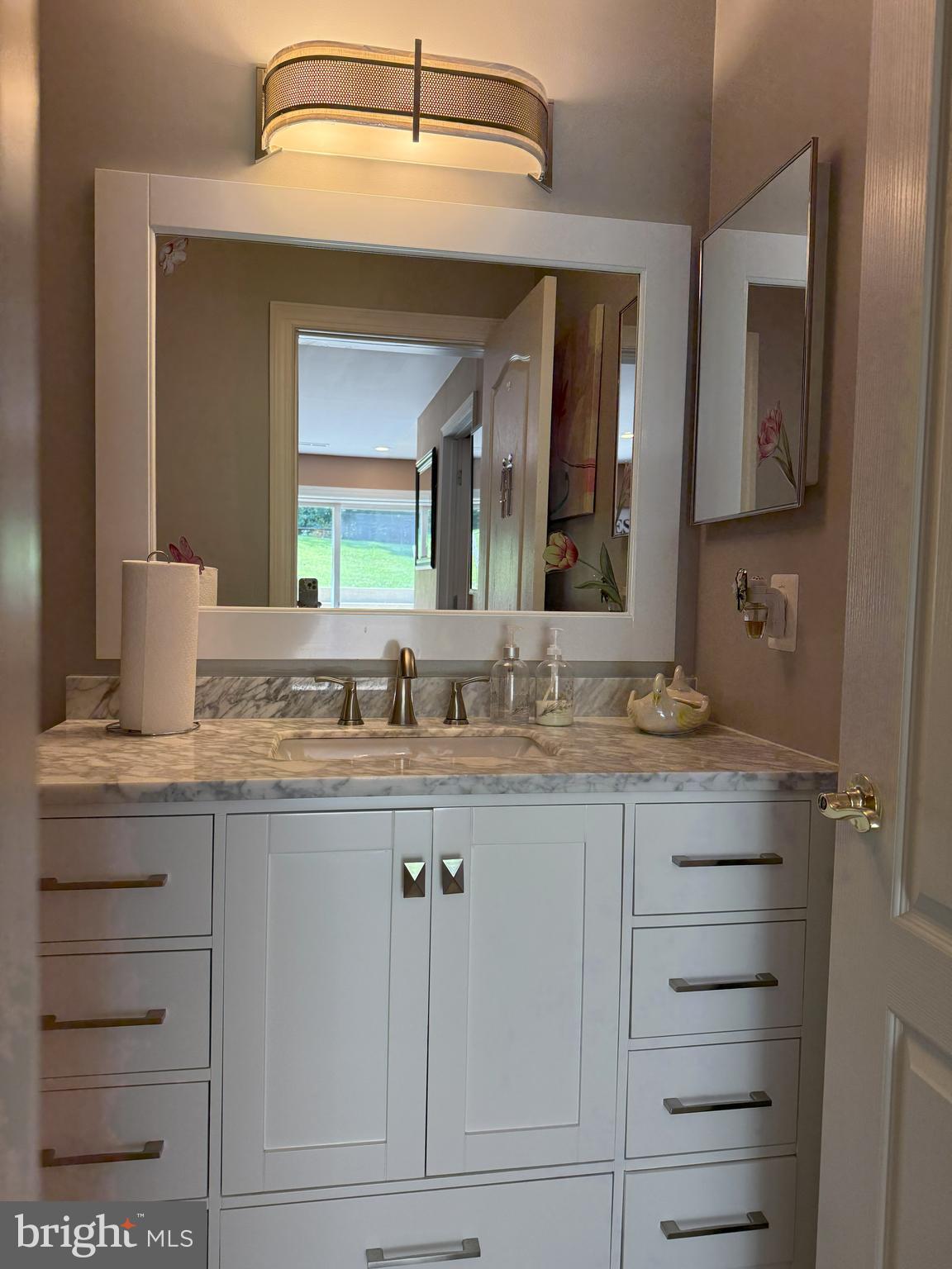 3919 Woodreed Drive Brandywine, MD 20613 - Photo 68 of 88 a bathroom with a granite countertop sink vanity and mirror