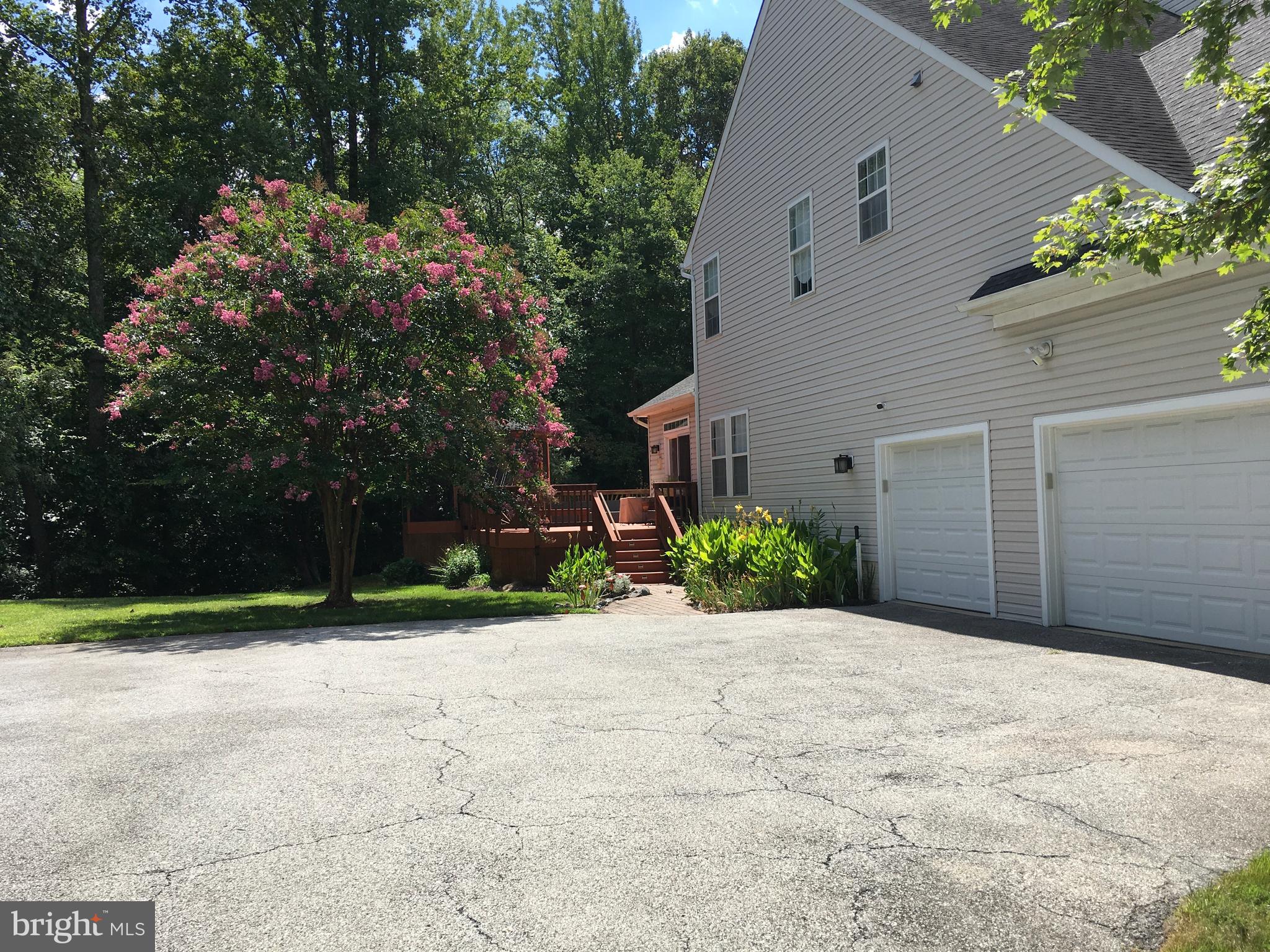 3919 Woodreed Drive Brandywine, MD 20613 - Photo 80 of 88 a view of a house with a yard and potted plants