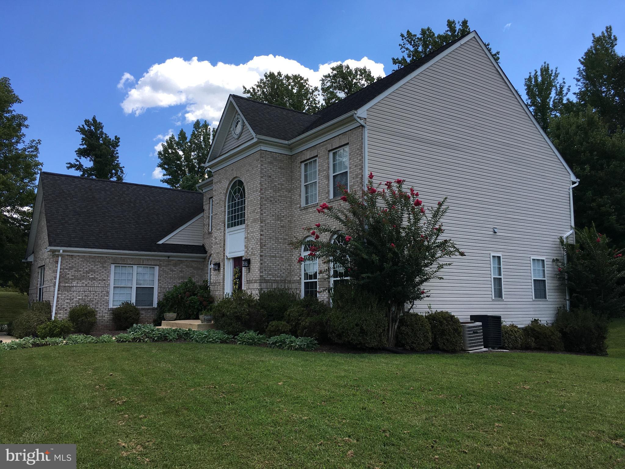 3919 Woodreed Drive Brandywine, MD 20613 - Photo 83 of 88 a front view of a house with a garden