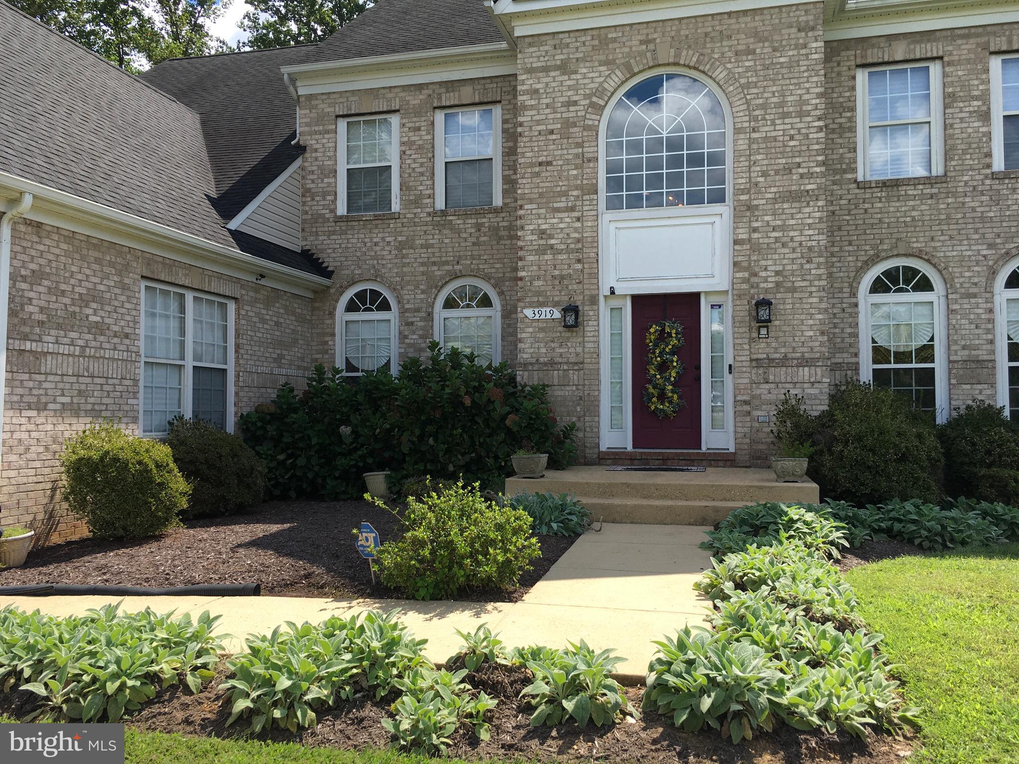 3919 Woodreed Drive Brandywine, MD 20613 - Photo 85 of 88 a front view of a house with garden