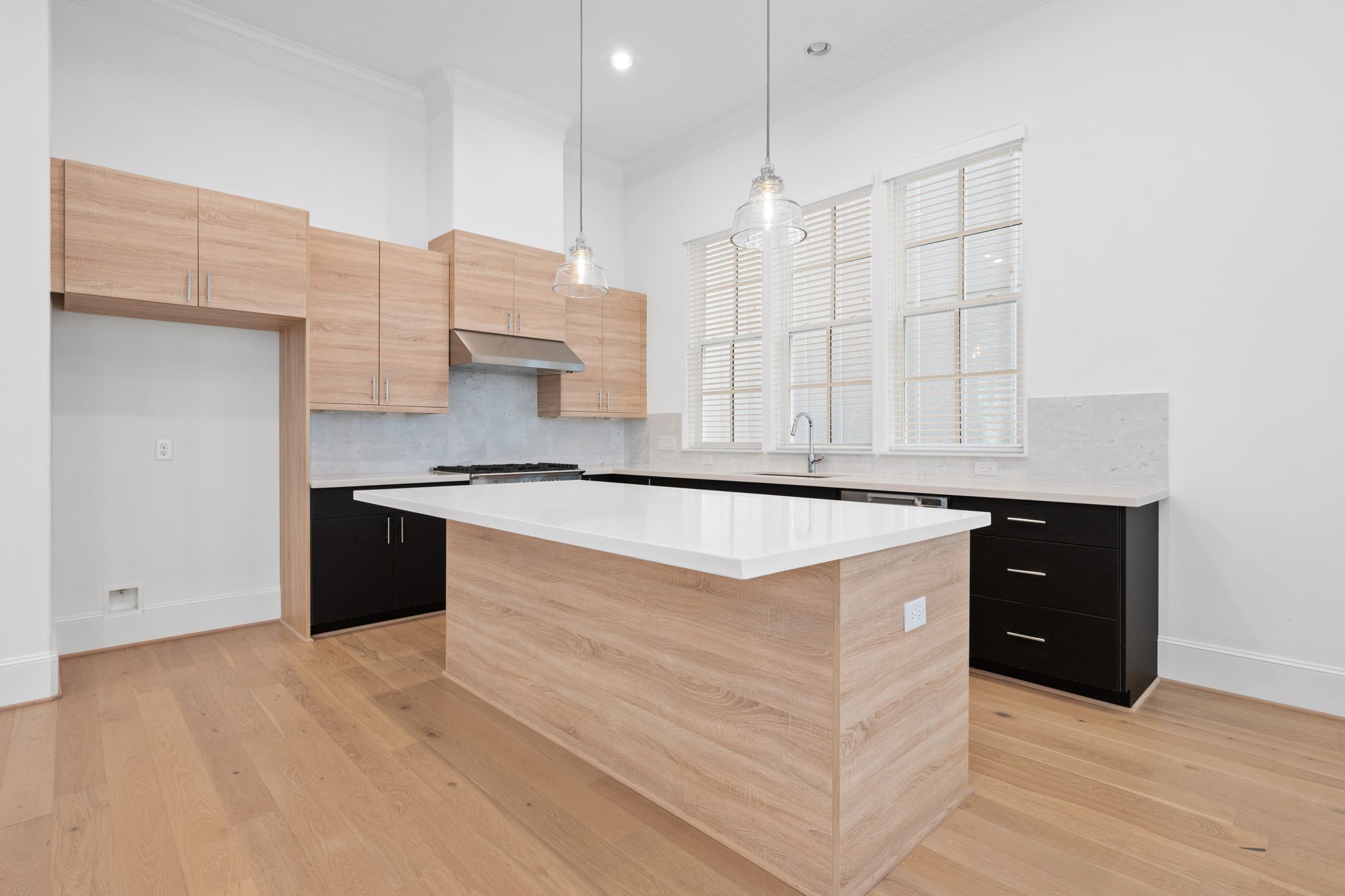 614 Delmar Street Houston, TX 77023 - Photo 11 of 36 a kitchen with stainless steel appliances granite countertop a sink a stove and a refrigerator