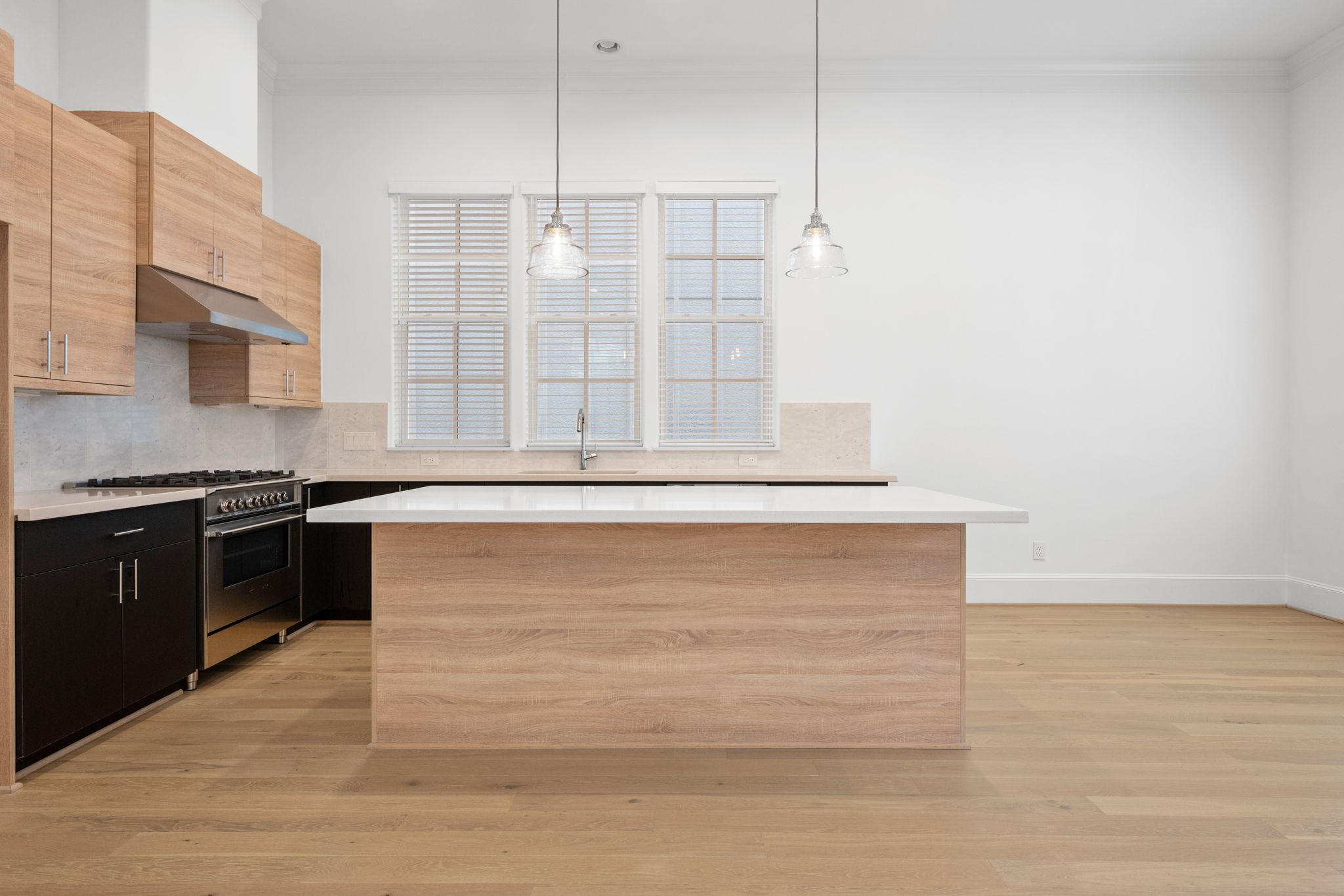 614 Delmar Street Houston, TX 77023 - Photo 13 of 36 a kitchen with a stove and a refrigerator