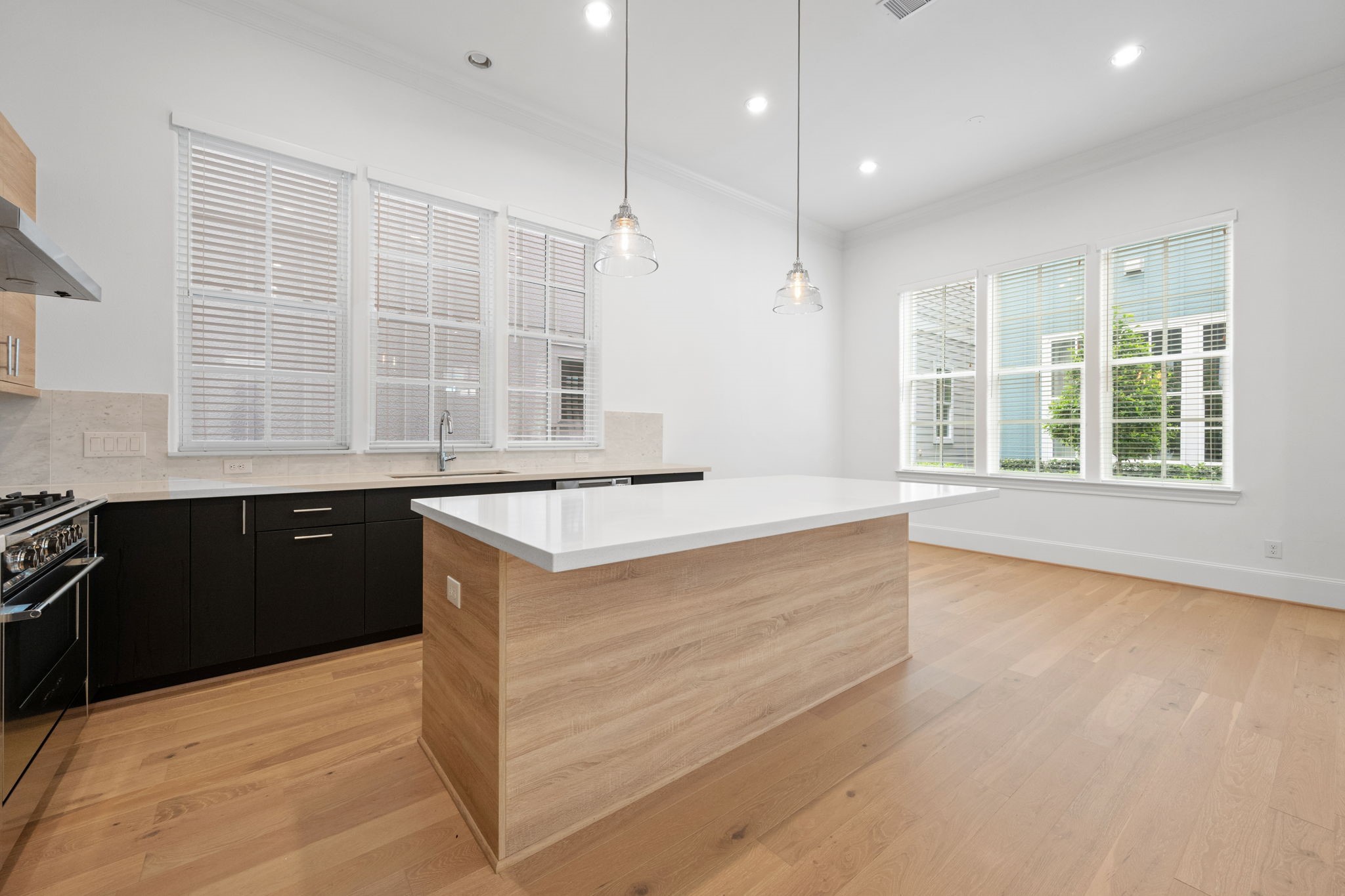 614 Delmar Street Houston, TX 77023 - Photo 14 of 36 a kitchen with granite countertop a sink and a stove
