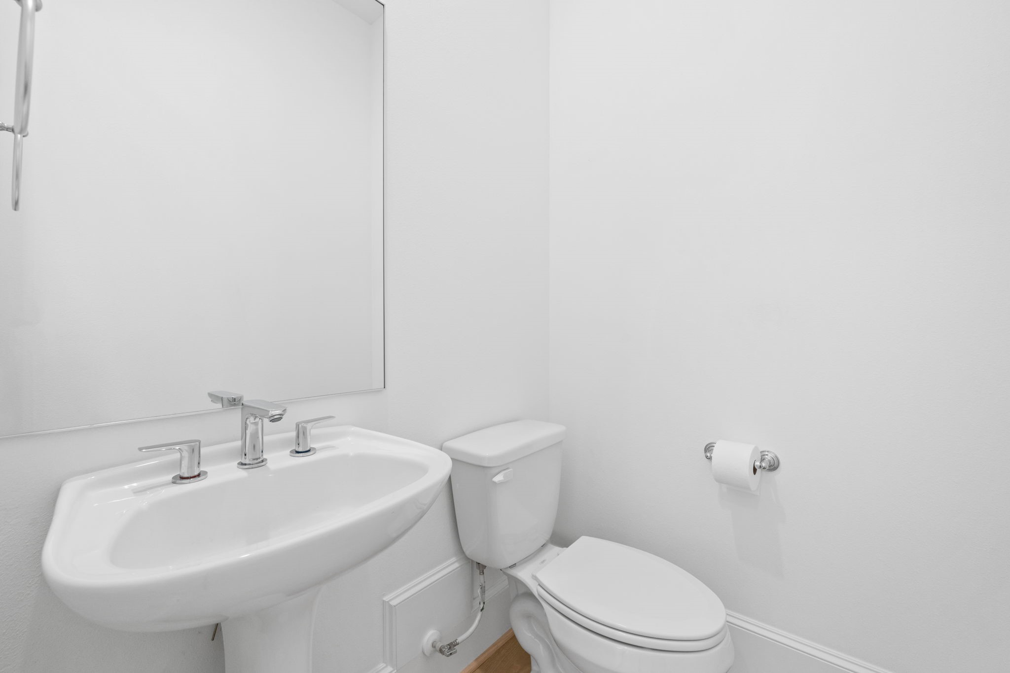 614 Delmar Street Houston, TX 77023 - Photo 18 of 36 a bathroom with a sink a toilet and mirror