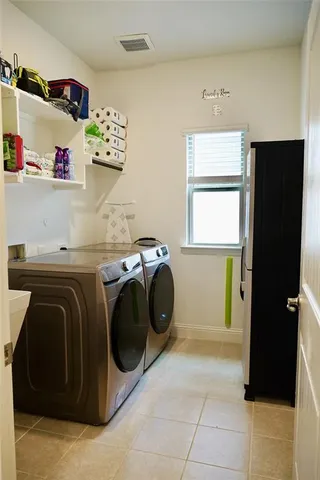 a utility room with dryer and washer
