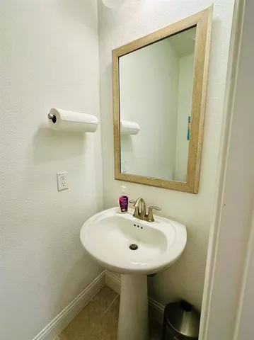 a bathroom with a sink a mirror and a toilet