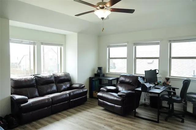 a living room with furniture and windows