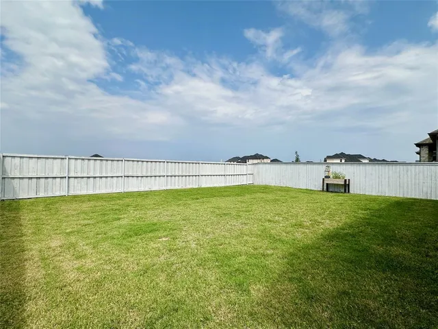 a view of a swimming pool and an outdoor seating