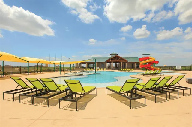 a balcony with chairs and a table