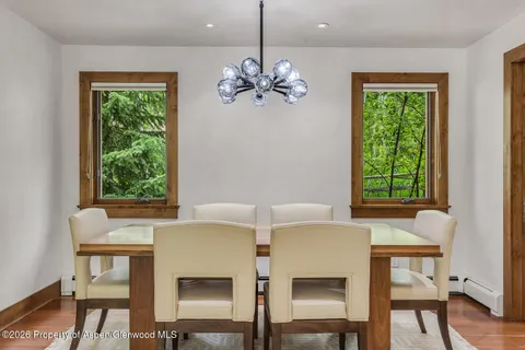 a view of a dining room with furniture window and outside view