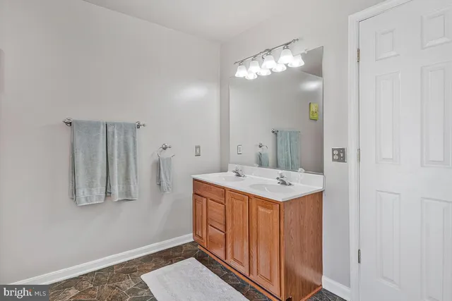 a utility room with cabinets washer and dryer