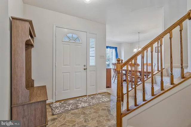 a view of an entryway with wooden floor