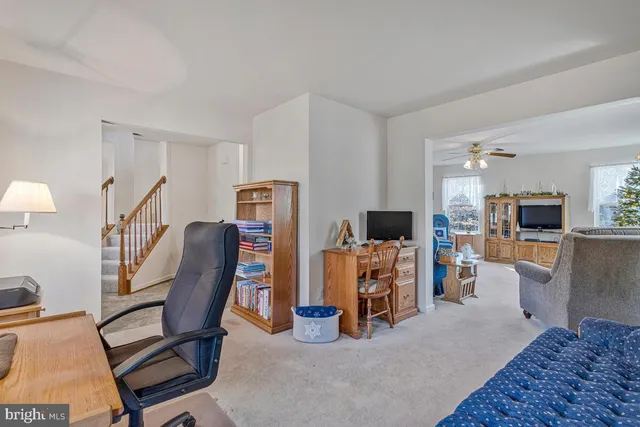 a view of a livingroom with furniture and a flat screen tv