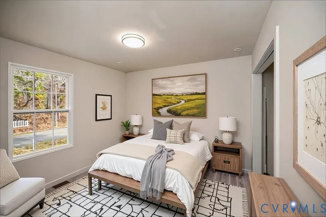 a bedroom with a bed and a window