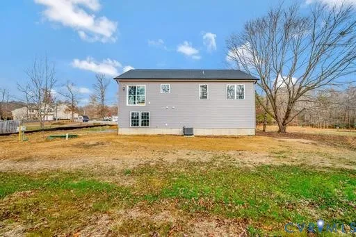 a house view with swimming pool in front of it