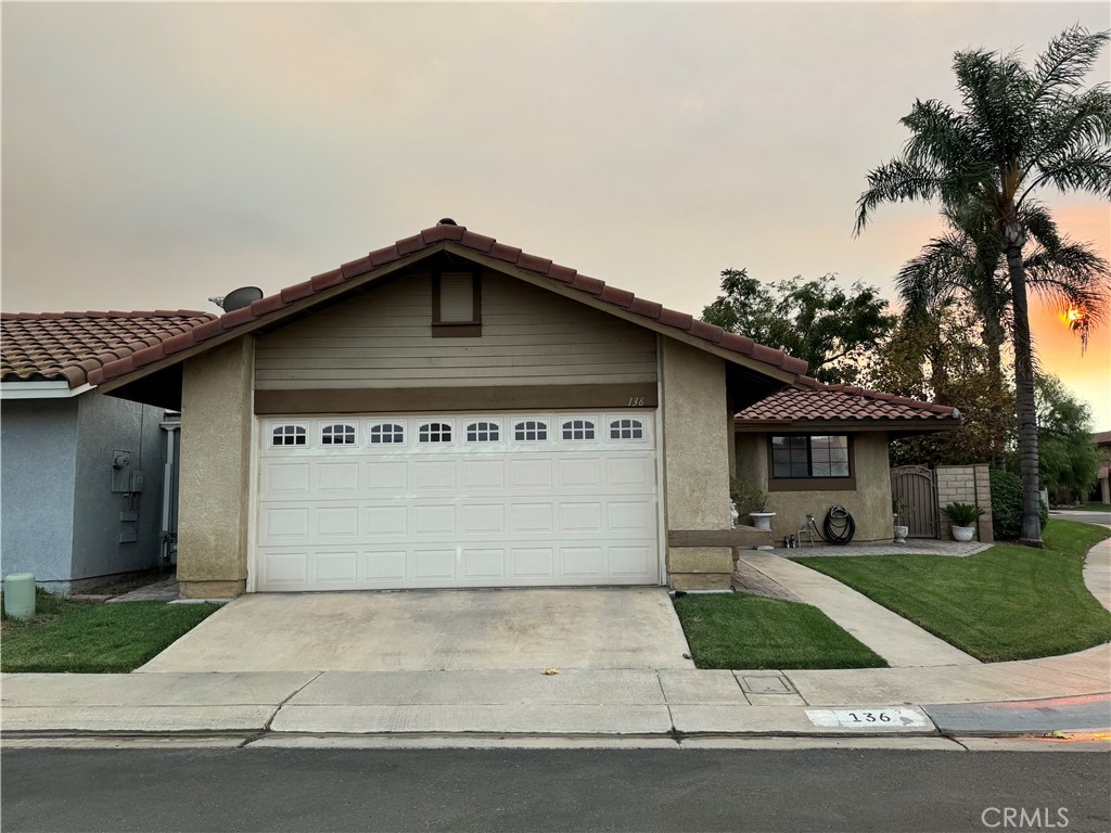 a front view of a house with garage
